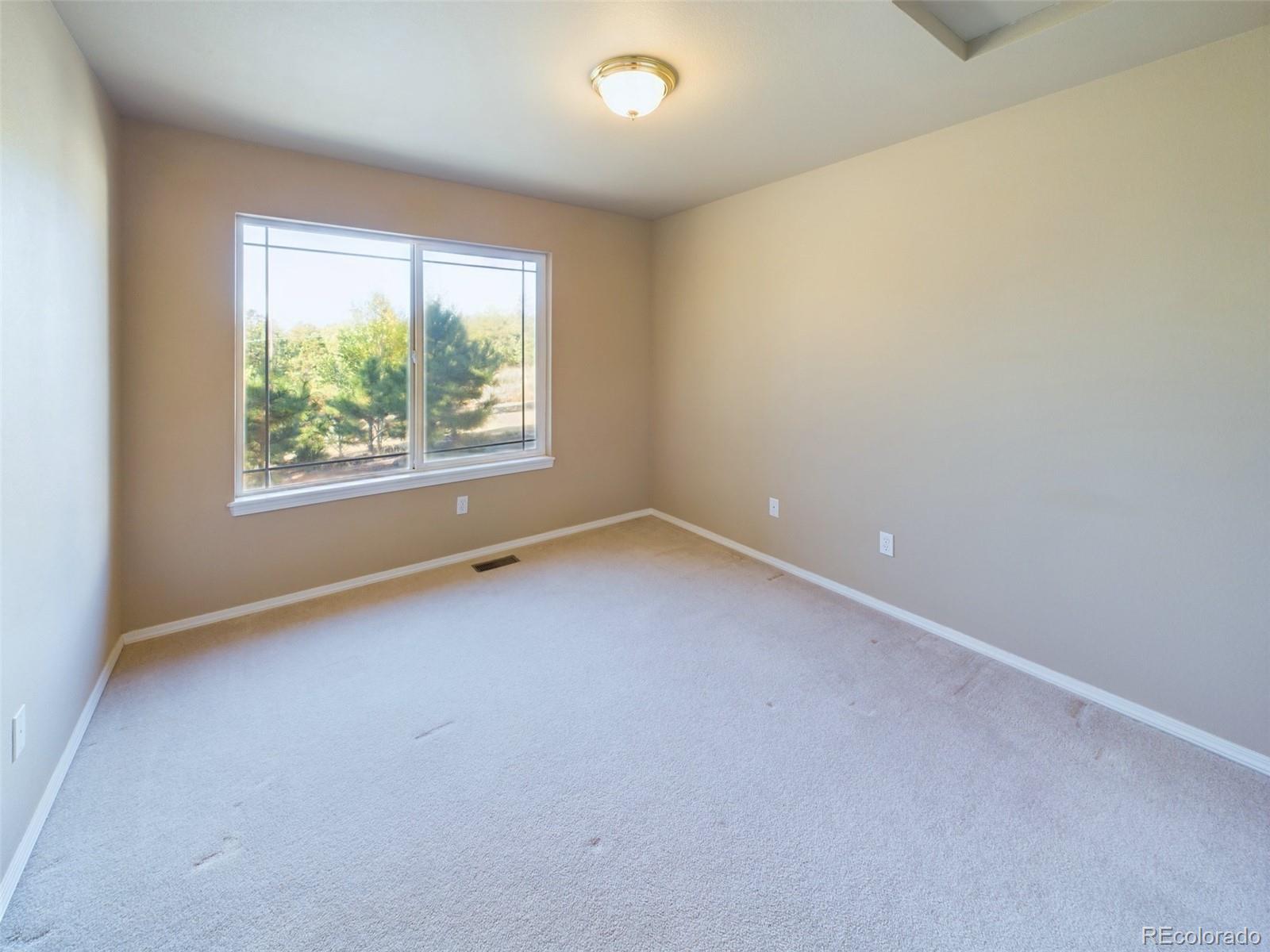 5140 Shoup Road Colorado Springs, CO 80908 - Photo 18 of 42 an empty room with windows