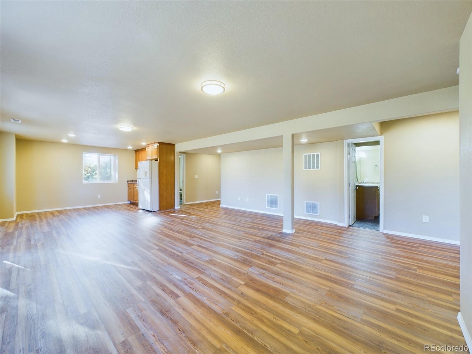 5140 Shoup Road Colorado Springs, CO 80908 - Photo 28 of 42 a view of an empty room with wooden floor