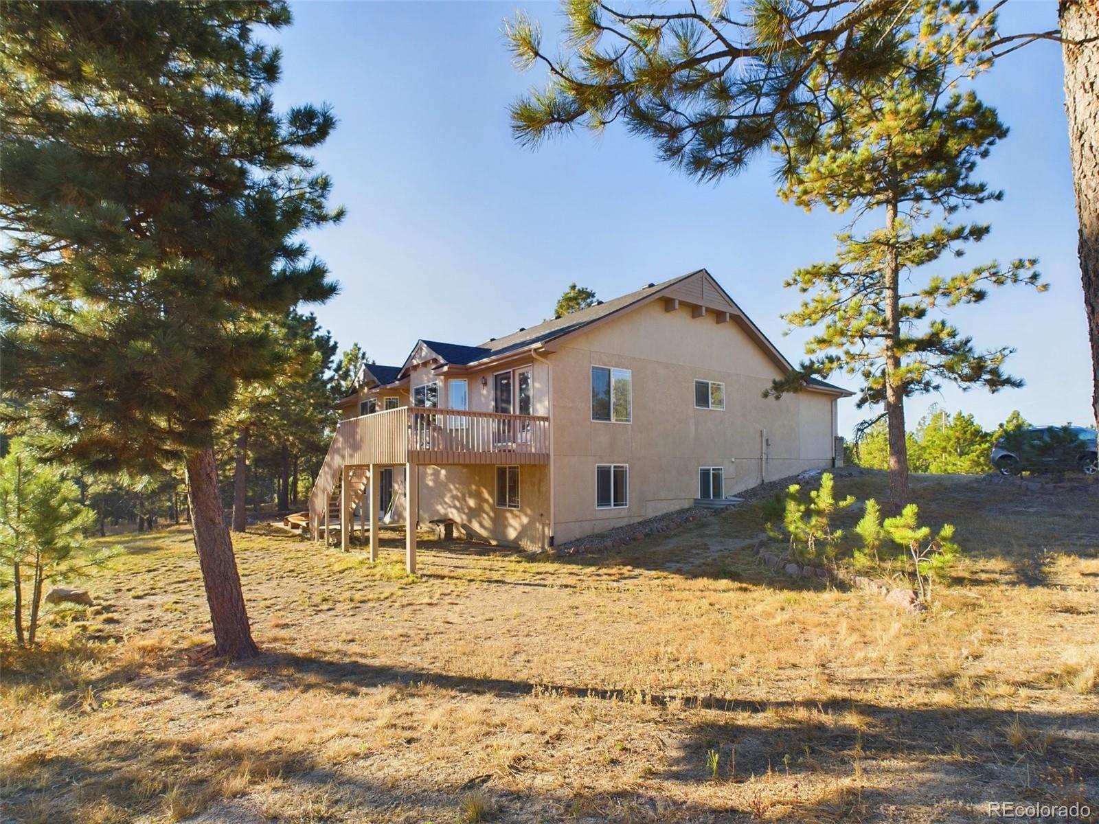 5140 Shoup Road Colorado Springs, CO 80908 - Photo 32 of 42 a view of a house with snow on the background