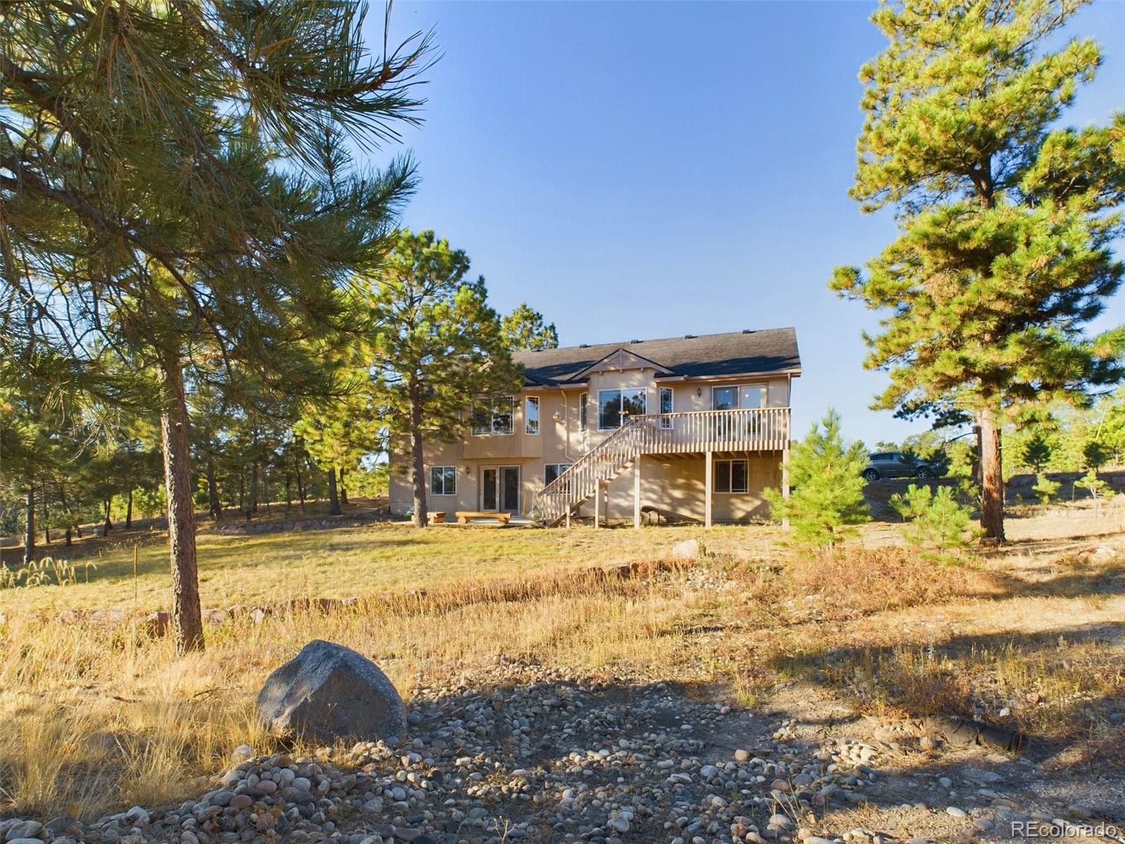5140 Shoup Road Colorado Springs, CO 80908 - Photo 34 of 42 a view of a house with snow on the road