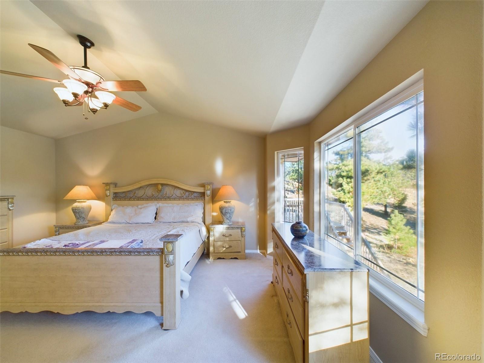 5140 Shoup Road Colorado Springs, CO 80908 - Photo 10 of 42 a bedroom with a bed and window