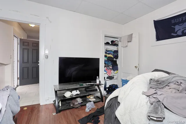 a kitchen with a sink cabinets and wooden floor