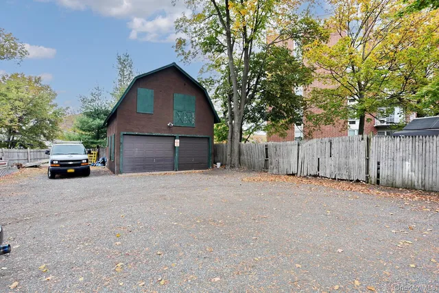 a view of road with large trees