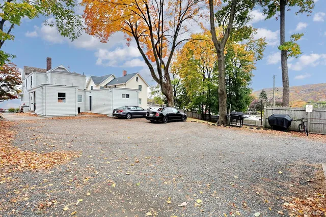a side view of a house with a garage