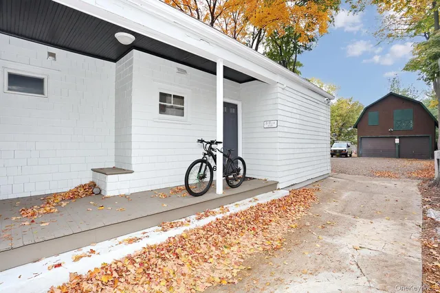 a front view of a house with a patio
