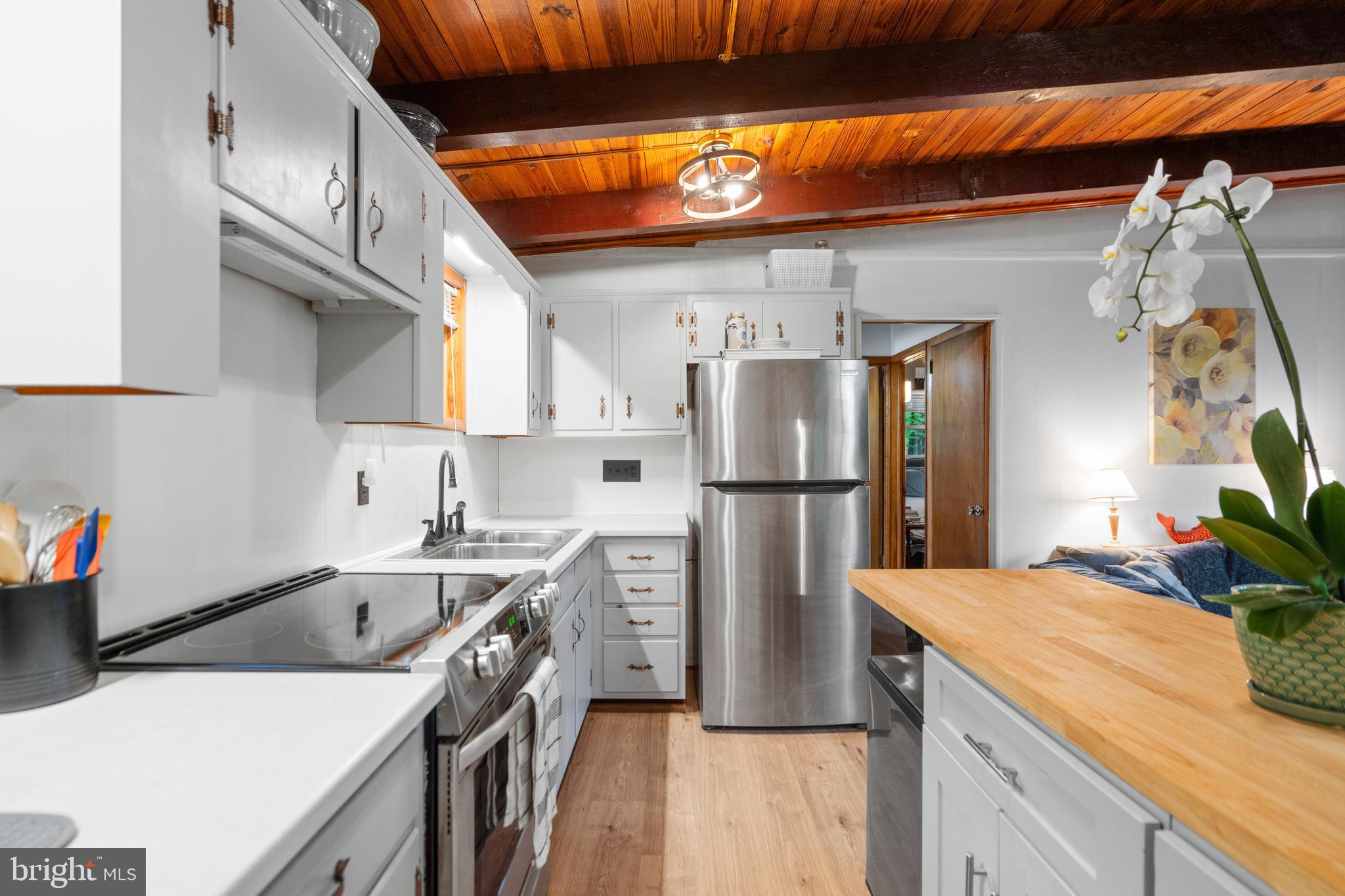 349 Club House Road Front Royal, VA 22630 - Photo 3 of 15 a kitchen with a sink a refrigerator and a stove
