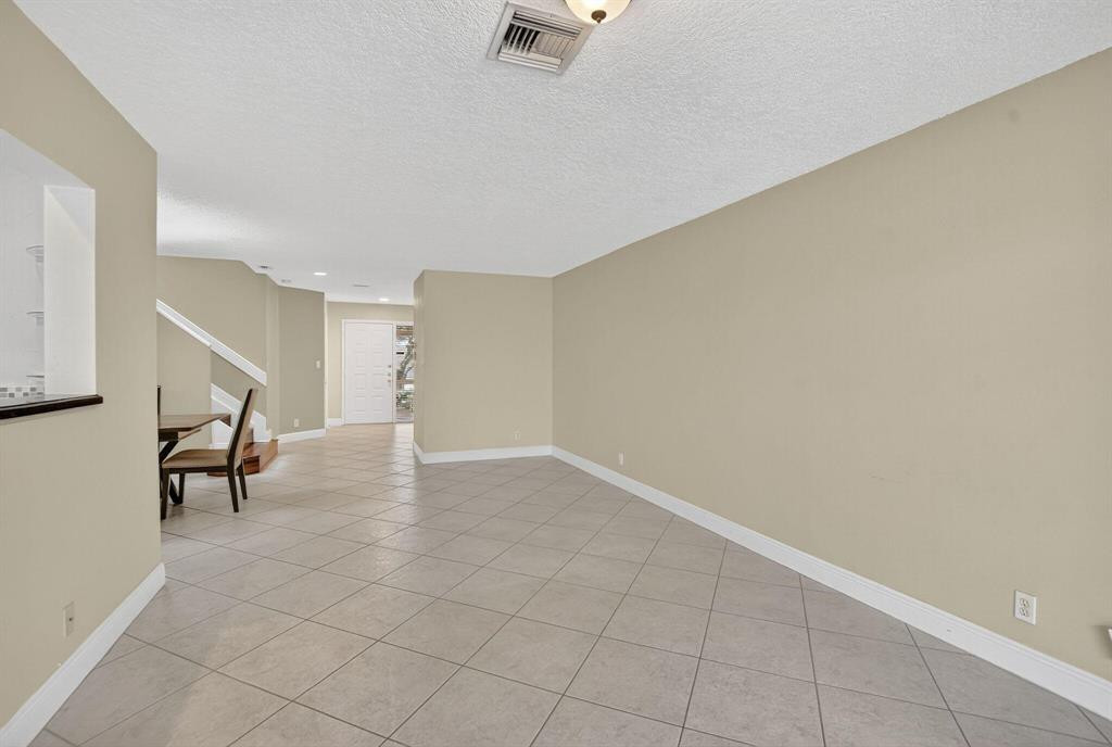 5051 Pointe Emerald Lane, Unit 5051 Boca Raton, FL 33431 - Photo 15 of 65 wooden floor in an empty room