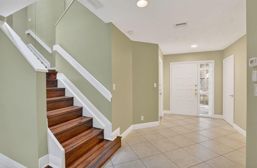 5051 Pointe Emerald Lane, Unit 5051 Boca Raton, FL 33431 - Photo 17 of 65 a view of an entryway with wooden floor