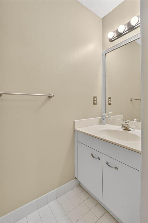 5051 Pointe Emerald Lane, Unit 5051 Boca Raton, FL 33431 - Photo 19 of 65 a bathroom with a sink and a mirror