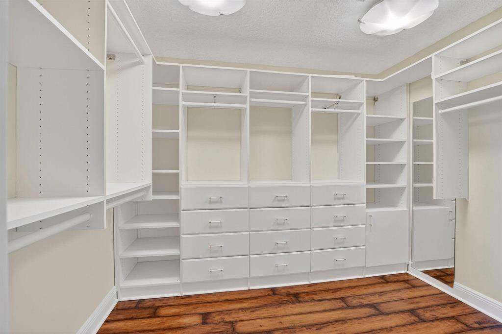 5051 Pointe Emerald Lane, Unit 5051 Boca Raton, FL 33431 - Photo 29 of 65 a view of walk in closet with empty racks
