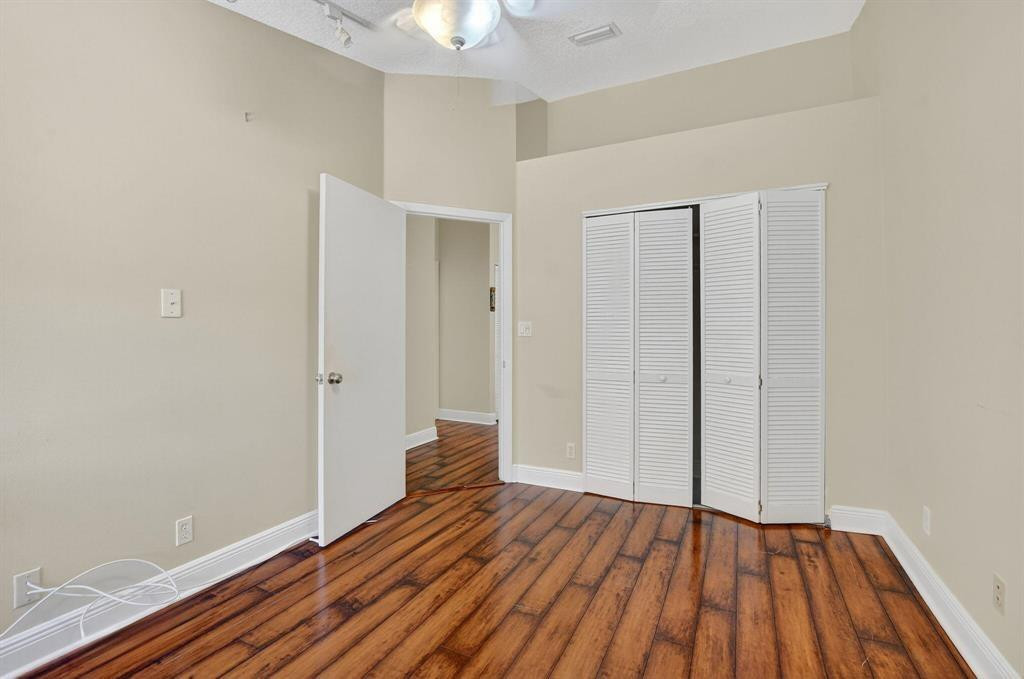 5051 Pointe Emerald Lane, Unit 5051 Boca Raton, FL 33431 - Photo 31 of 65 wooden floor in an empty room
