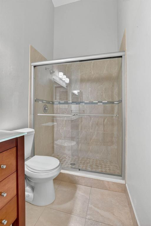 5051 Pointe Emerald Lane, Unit 5051 Boca Raton, FL 33431 - Photo 33 of 65 a bathroom with a toilet and a shower