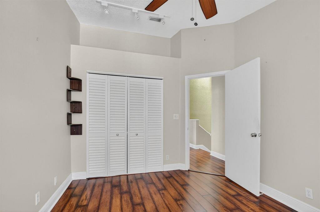 5051 Pointe Emerald Lane, Unit 5051 Boca Raton, FL 33431 - Photo 36 of 65 wooden floor in an empty room