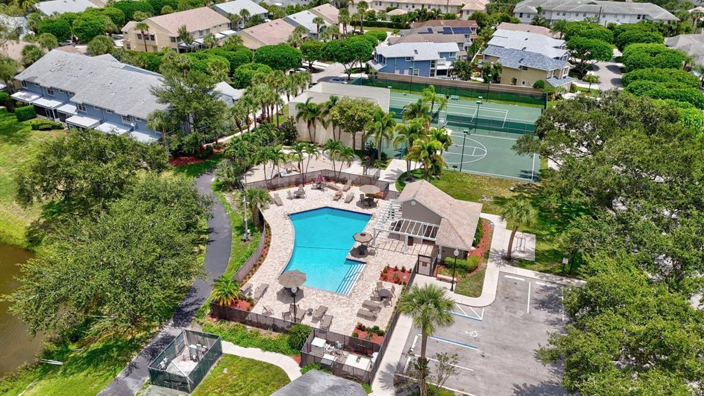 5051 Pointe Emerald Lane, Unit 5051 Boca Raton, FL 33431 - Photo 49 of 65 an aerial view of house with yard swimming pool and outdoor seating
