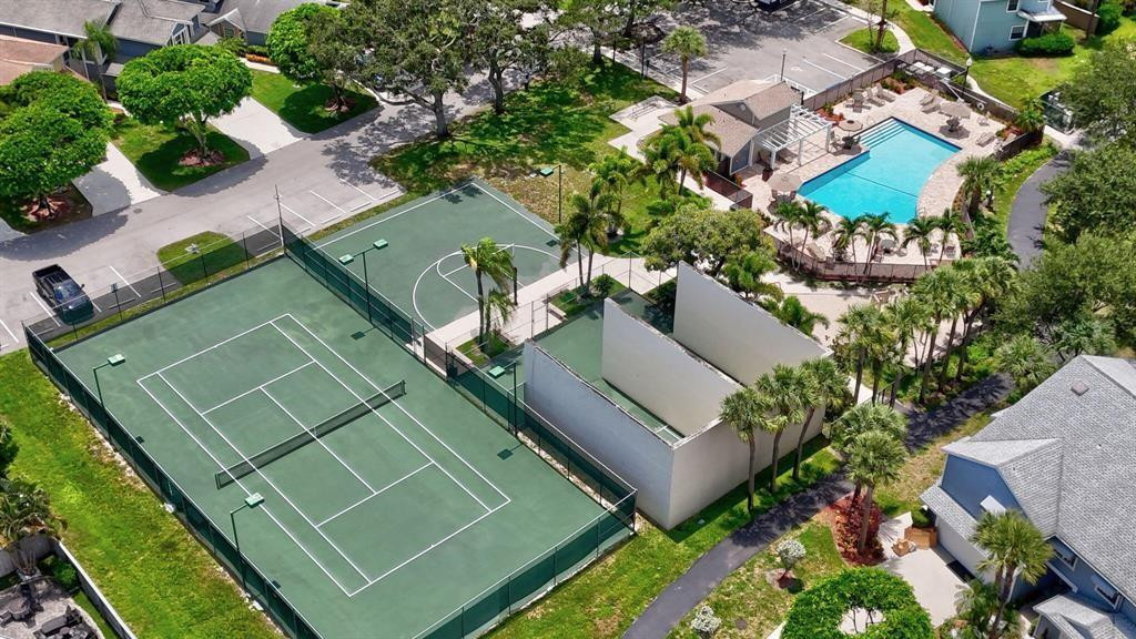 5051 Pointe Emerald Lane, Unit 5051 Boca Raton, FL 33431 - Photo 54 of 65 an aerial view of a tennis court