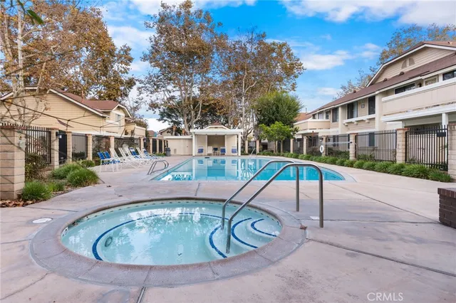 a view of a patio with swimming pool table and chairs