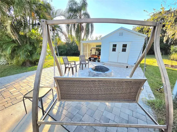 a view of swimming pool with a patio