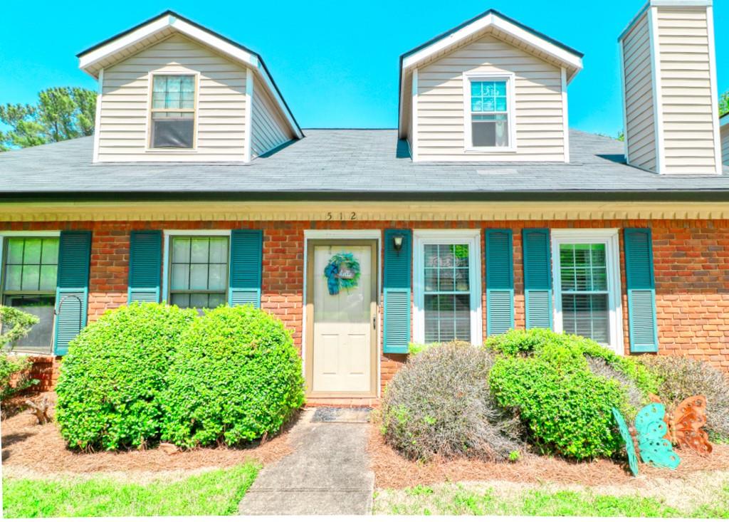 512 Huntington Road Athens, GA 30606 - Photo 1 of 1 a front view of a house with garden