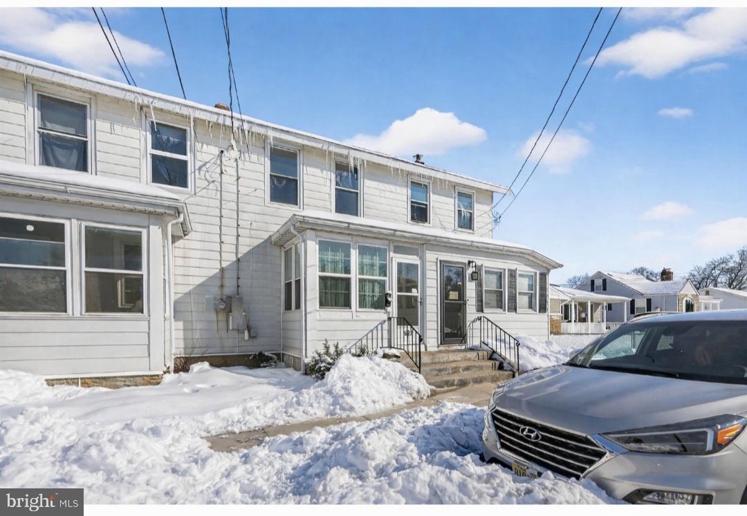 a view of a patio with a yard