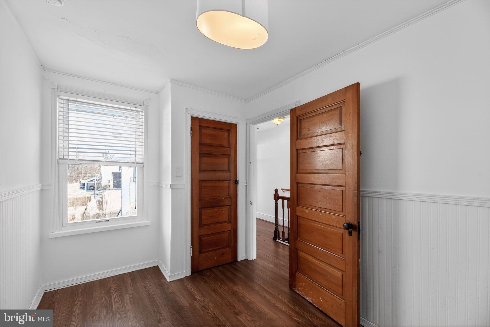 521 Bem Street Riverside, NJ 08075 - Photo 11 of 16 an empty room with wooden floor closet and windows