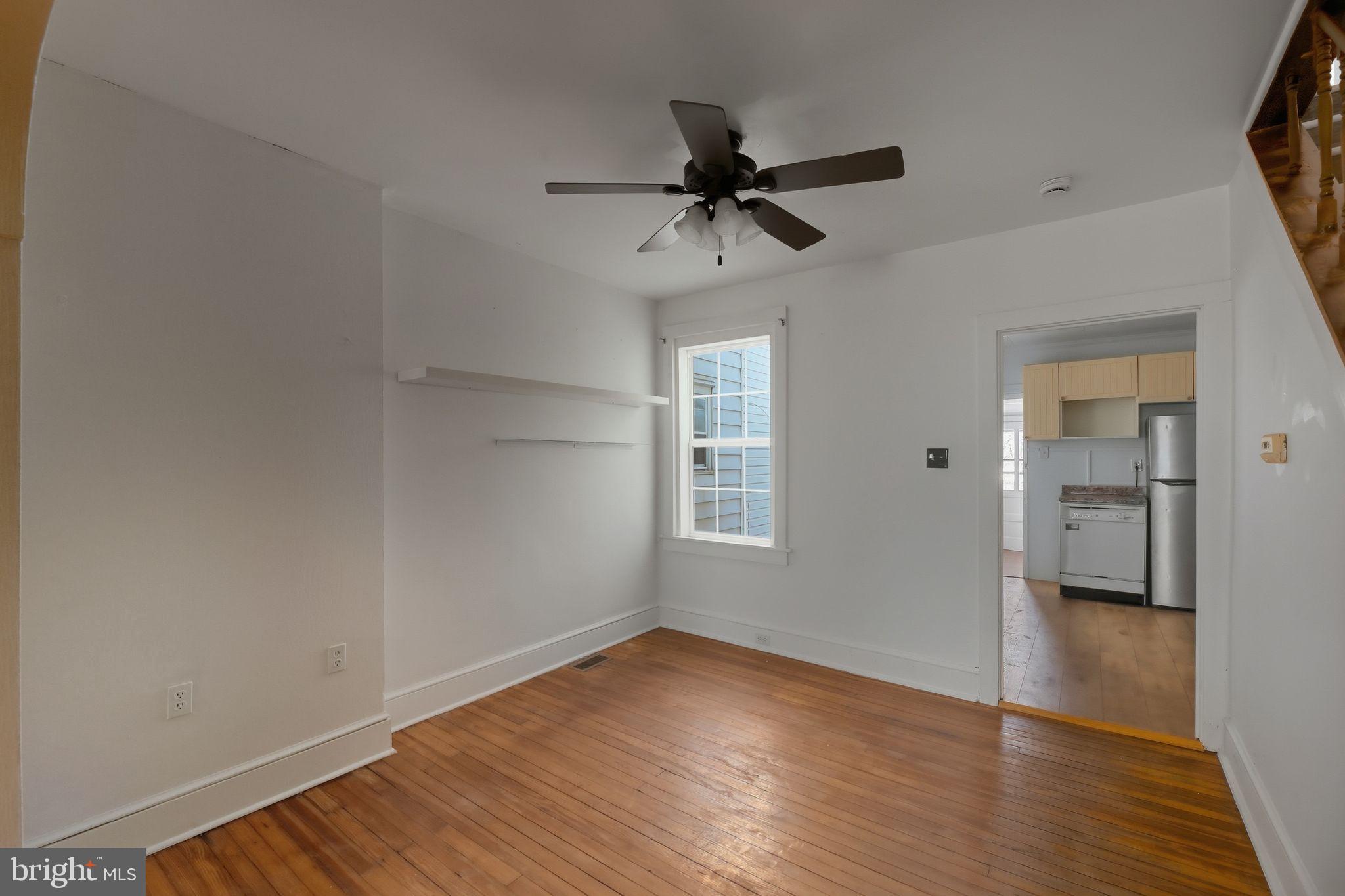 521 Bem Street Riverside, NJ 08075 - Photo 13 of 16 a view of empty room with wooden floor and fan
