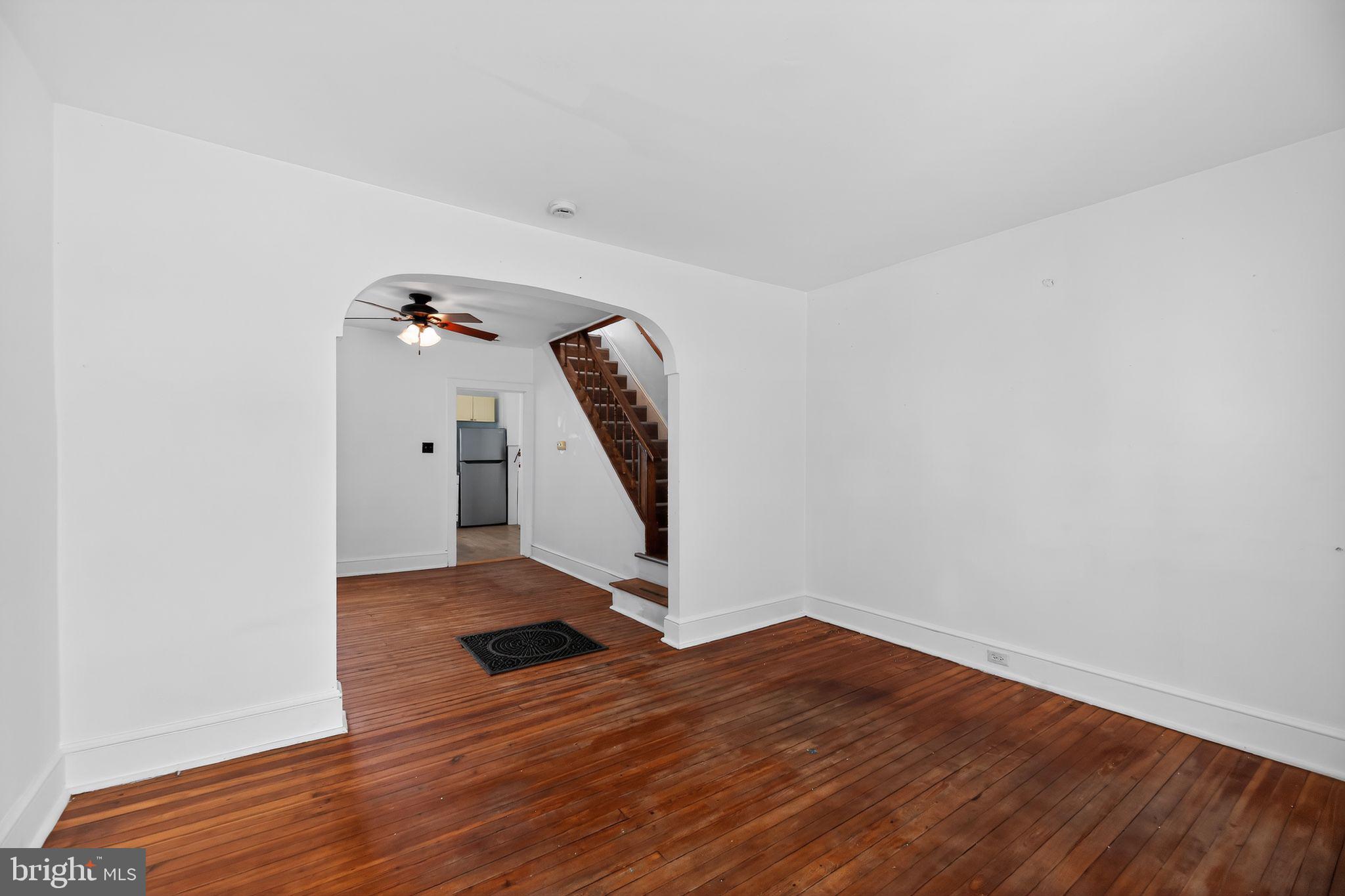 521 Bem Street Riverside, NJ 08075 - Photo 3 of 16 a view of a room with wooden floor and stairs