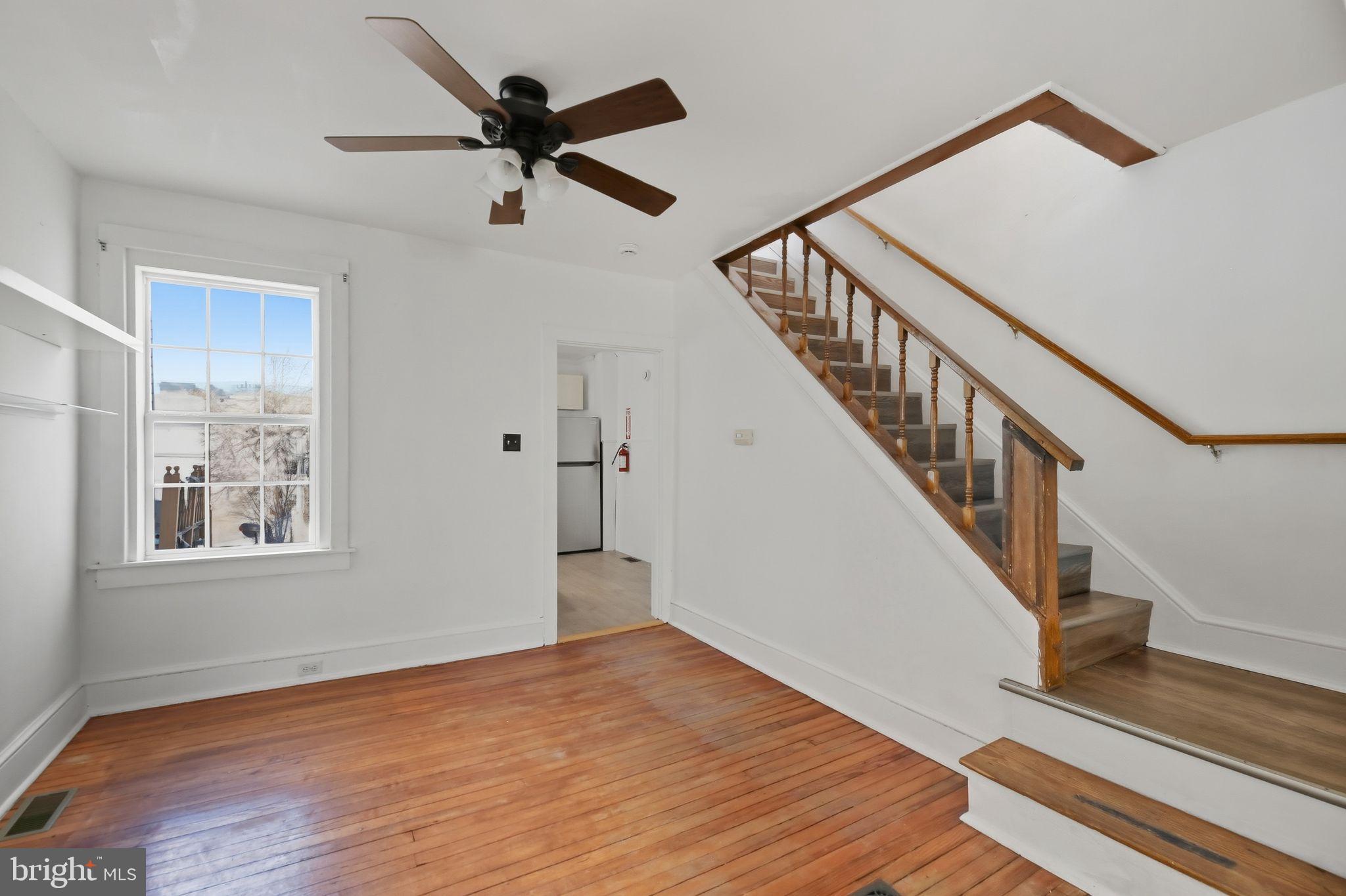 521 Bem Street Riverside, NJ 08075 - Photo 5 of 16 a view of empty room with wooden floor and fan