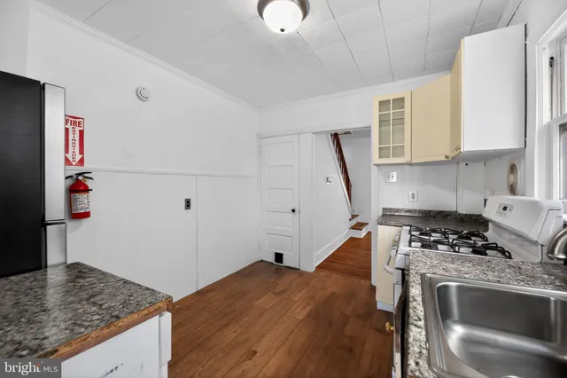 a kitchen with a stove and a refrigerator