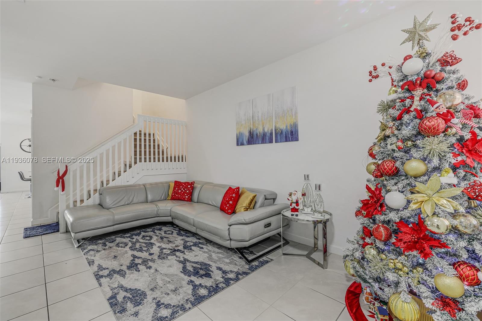 11907 Southwest 247th Terrace Homestead, FL 33032 - Photo 2 of 35 a living room with furniture and flowers