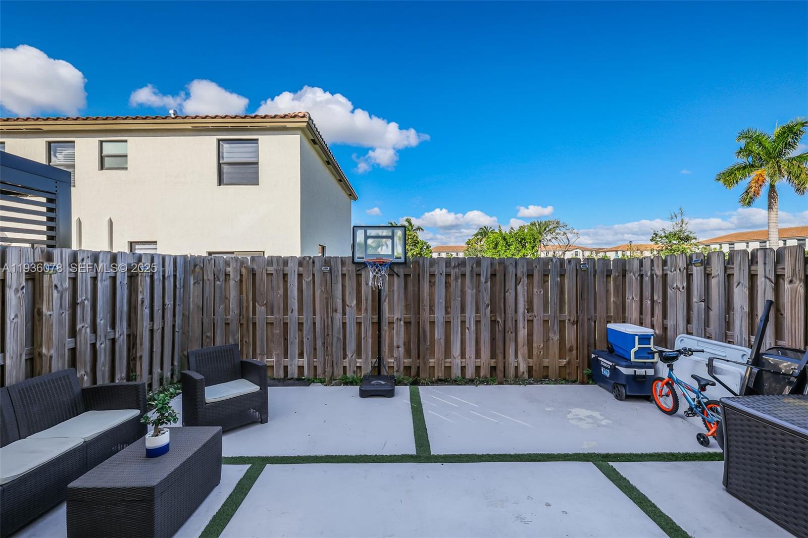 11907 Southwest 247th Terrace Homestead, FL 33032 - Photo 27 of 35 a backyard of a house with table and chairs
