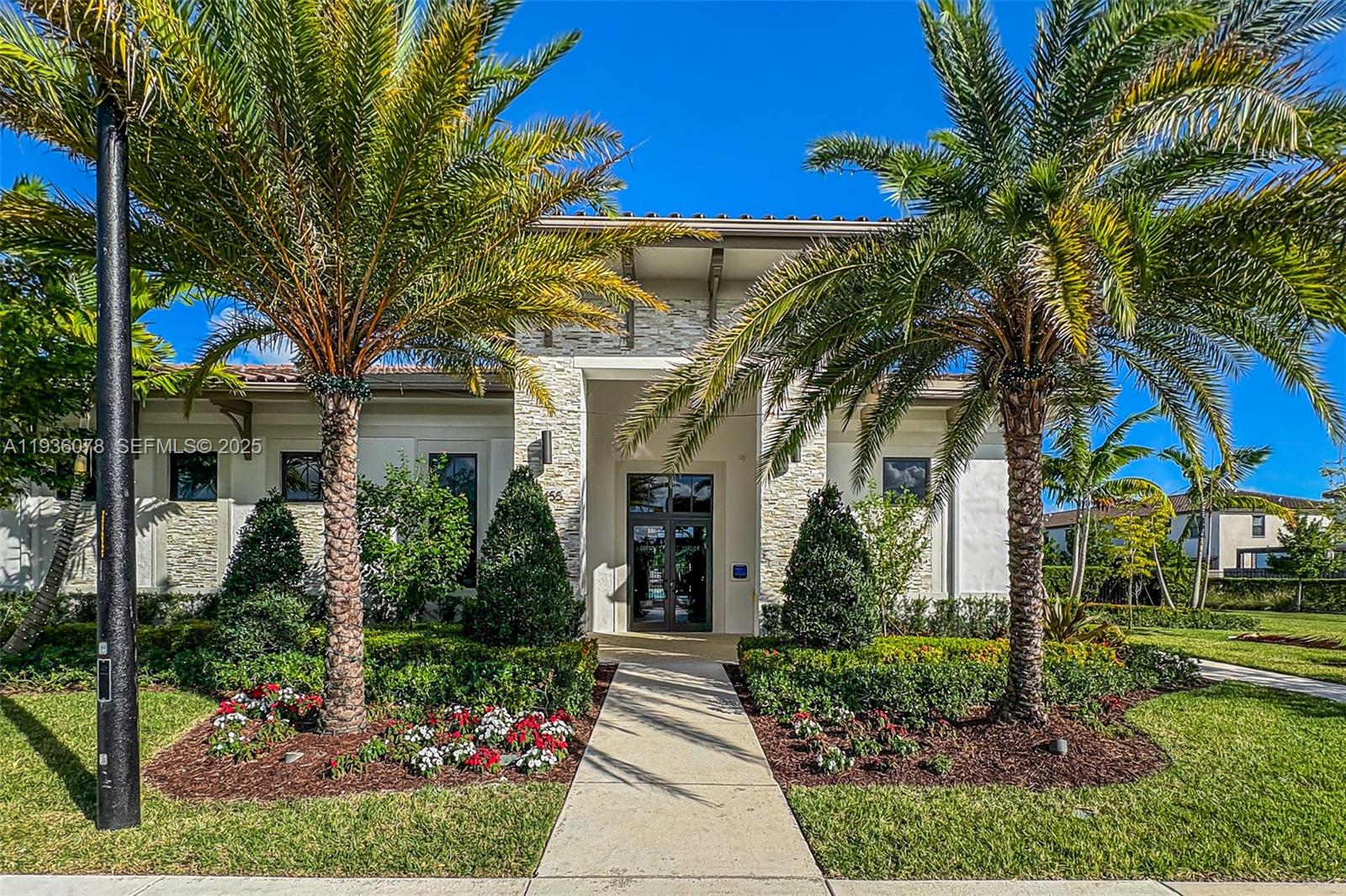 11907 Southwest 247th Terrace Homestead, FL 33032 - Photo 28 of 35 a front view of a house with garden