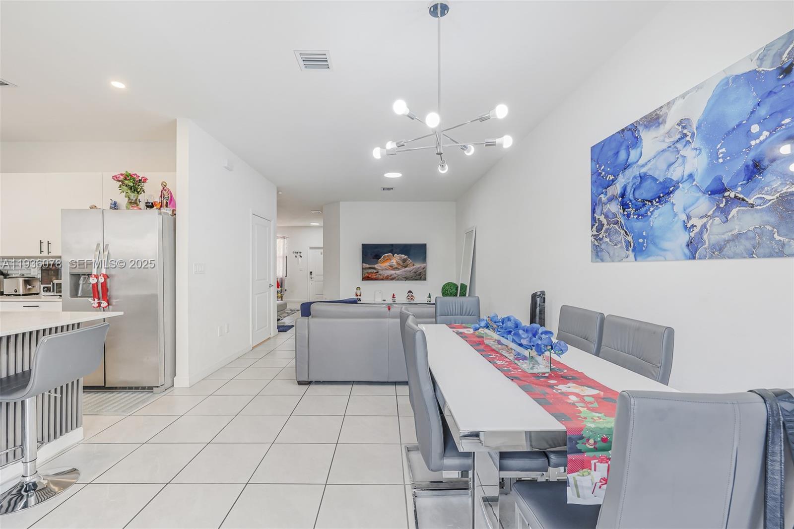 11907 Southwest 247th Terrace Homestead, FL 33032 - Photo 7 of 35 a living room with furniture and kitchen view