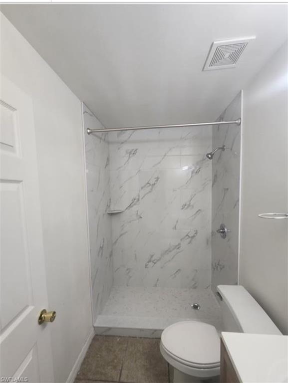 1854 55th Terrace Southwest Naples, FL 34116 - Photo 6 of 9 Full bathroom with vanity, a marble finish shower, and tile patterned flooring