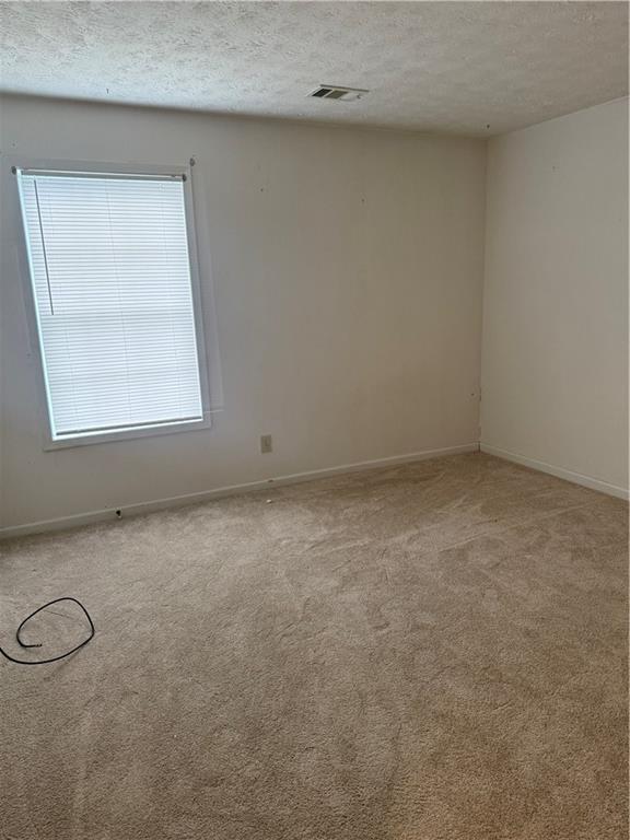682 Bridge Way Lithonia, GA 30058 - Photo 18 of 25 an empty room with a window
