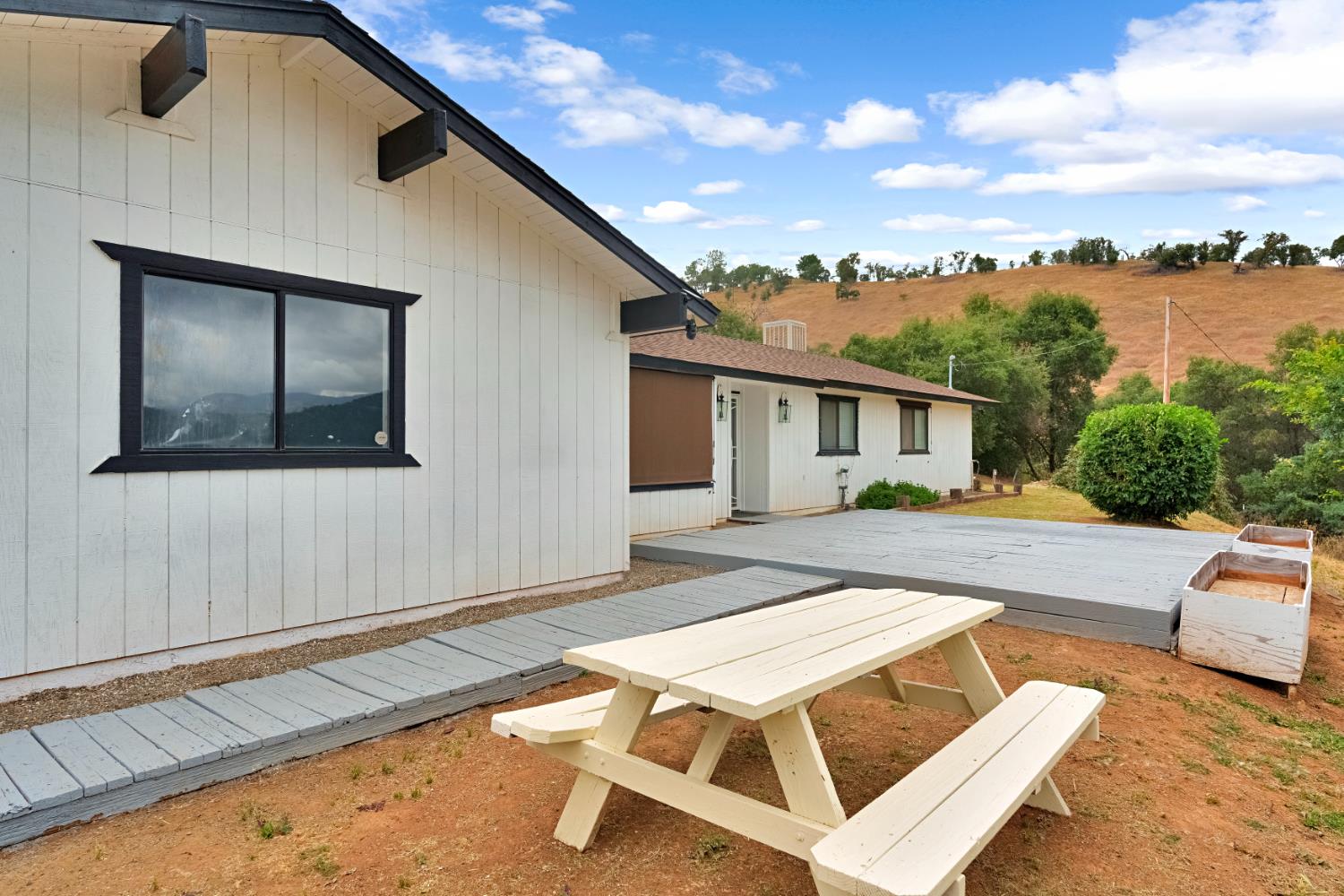 29668 Seminole Road Tollhouse, CA 93667 - Photo 22 of 28 a view of house with swimming pool outdoor seating