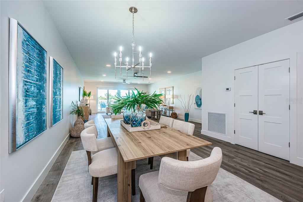12305 3rd Street East, Unit 2 Treasure Island, FL 33706 - Photo 12 of 69 a view of a dining room with furniture window and wooden floor