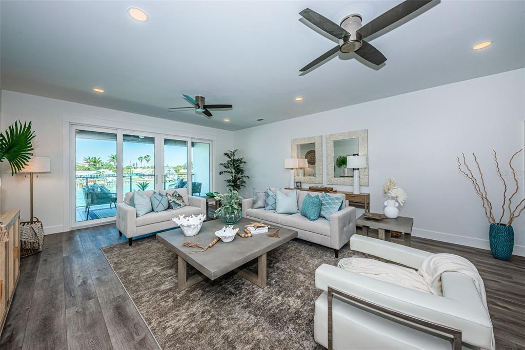 12305 3rd Street East, Unit 2 Treasure Island, FL 33706 - Photo 13 of 69 a living room with furniture and a large window