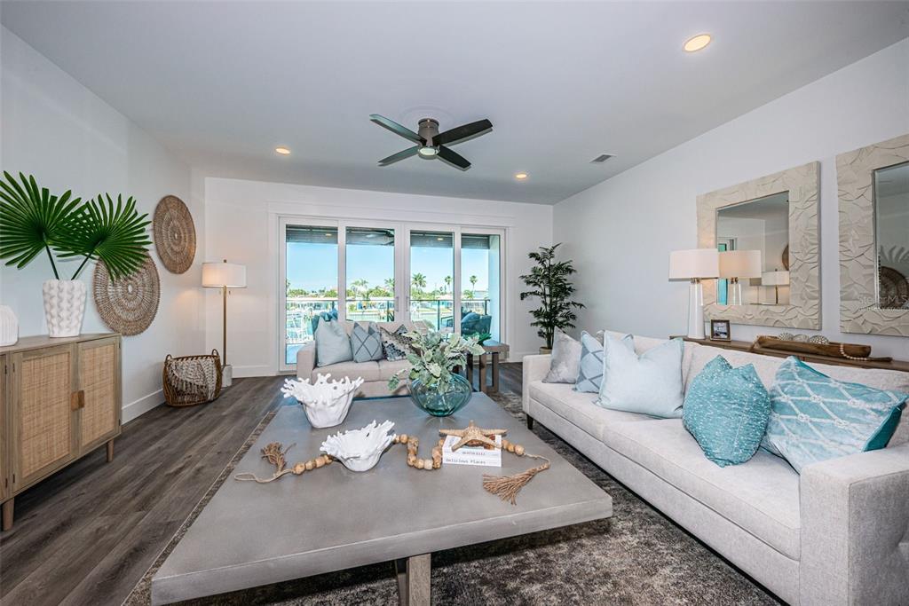 12305 3rd Street East, Unit 2 Treasure Island, FL 33706 - Photo 14 of 69 a living room with furniture and a large window