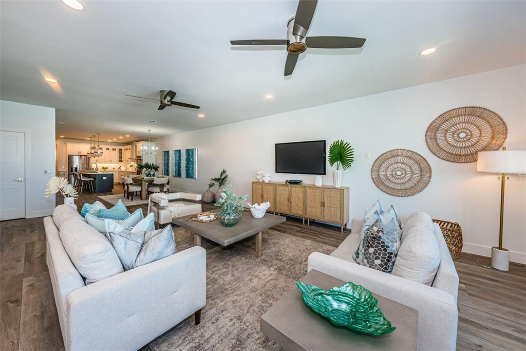 12305 3rd Street East, Unit 2 Treasure Island, FL 33706 - Photo 21 of 69 a living room with furniture and a clock