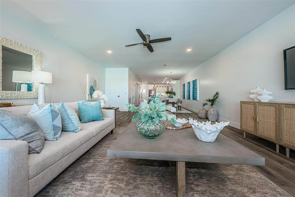 12305 3rd Street East, Unit 2 Treasure Island, FL 33706 - Photo 22 of 69 a living room with furniture kitchen and a table