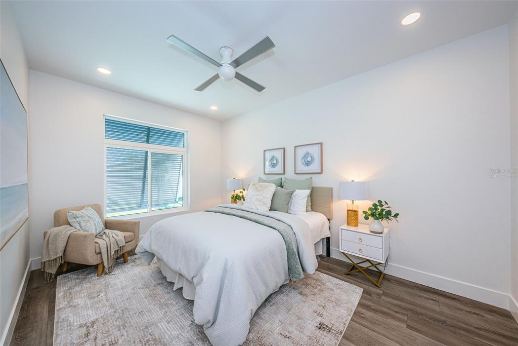 12305 3rd Street East, Unit 2 Treasure Island, FL 33706 - Photo 29 of 69 a bedroom with a bed and a window