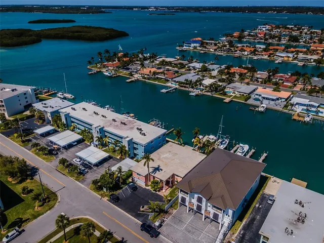 an aerial view of a house with a ocean view