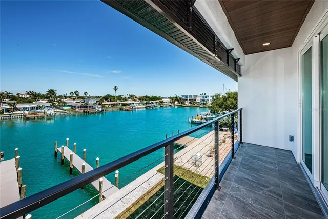 a spacious bathroom with a double vanity sink a large mirror and a bathtub