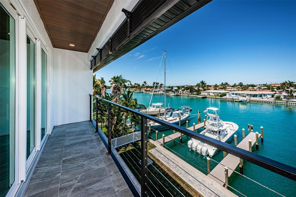 12305 3rd Street East, Unit 2 Treasure Island, FL 33706 - Photo 36 of 69 a view of a balcony with chairs