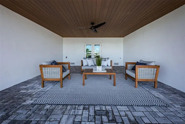 an aerial view of a house with garden space and street view