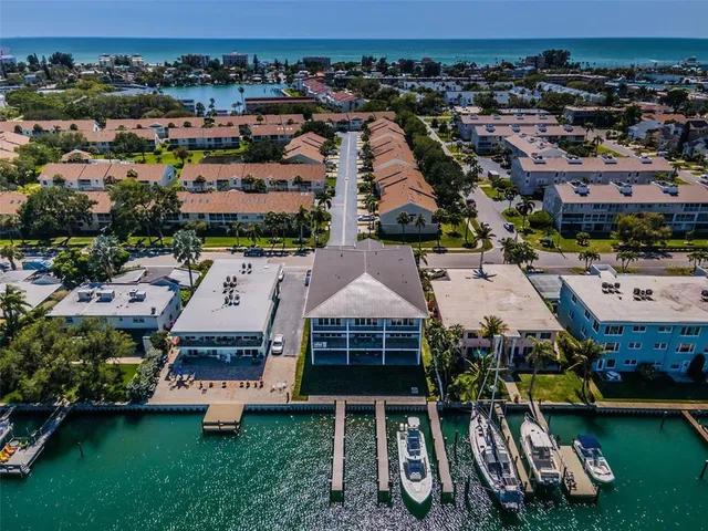 an aerial view of a house with a ocean view