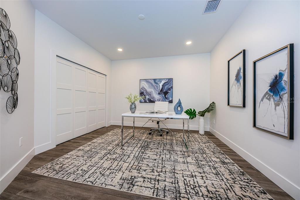12305 3rd Street East, Unit 2 Treasure Island, FL 33706 - Photo 51 of 69 a living room with a rug