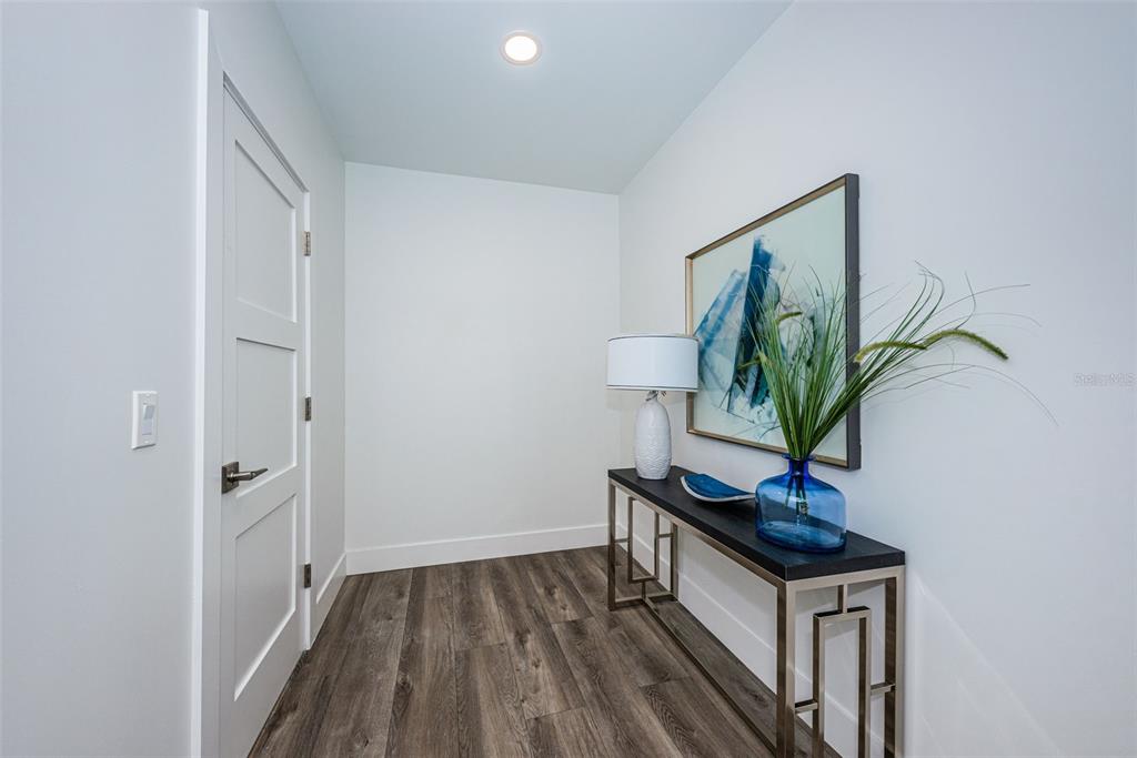 12305 3rd Street East, Unit 2 Treasure Island, FL 33706 - Photo 53 of 69 a view of entryway with wooden floor