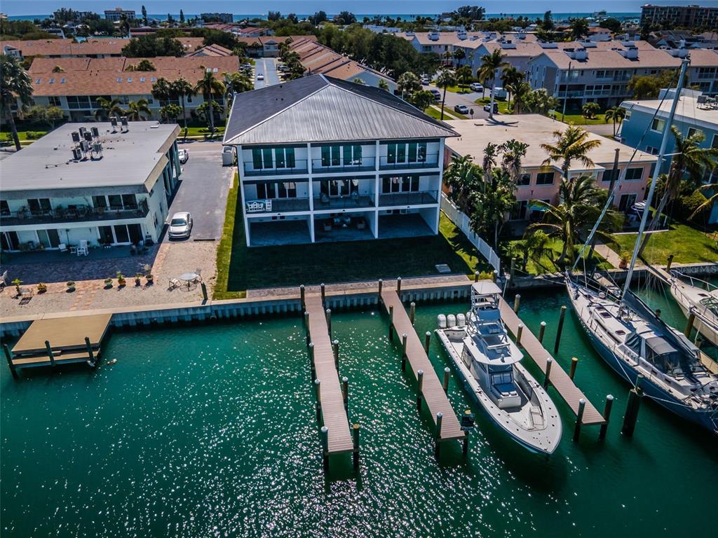 12305 3rd Street East, Unit 2 Treasure Island, FL 33706 - Photo 61 of 69 an aerial view of a house with garden space and street view