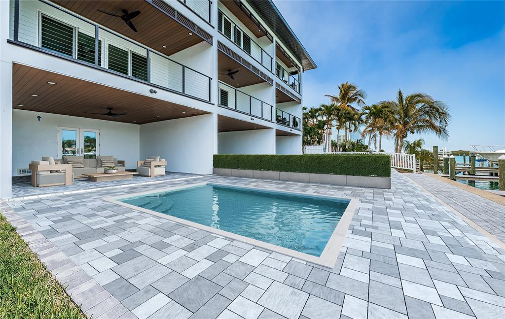 12305 3rd Street East, Unit 2 Treasure Island, FL 33706 - Photo 62 of 69 a view of a building with a yard